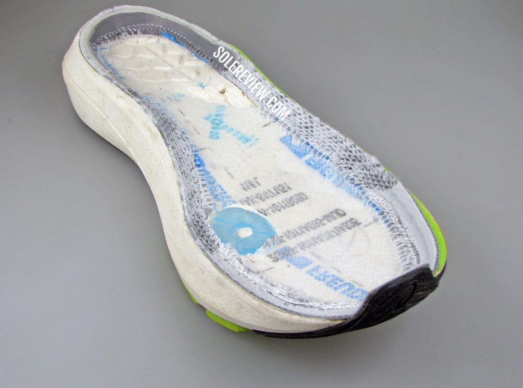 The midsole of the Asics Kayano Lite cut open.