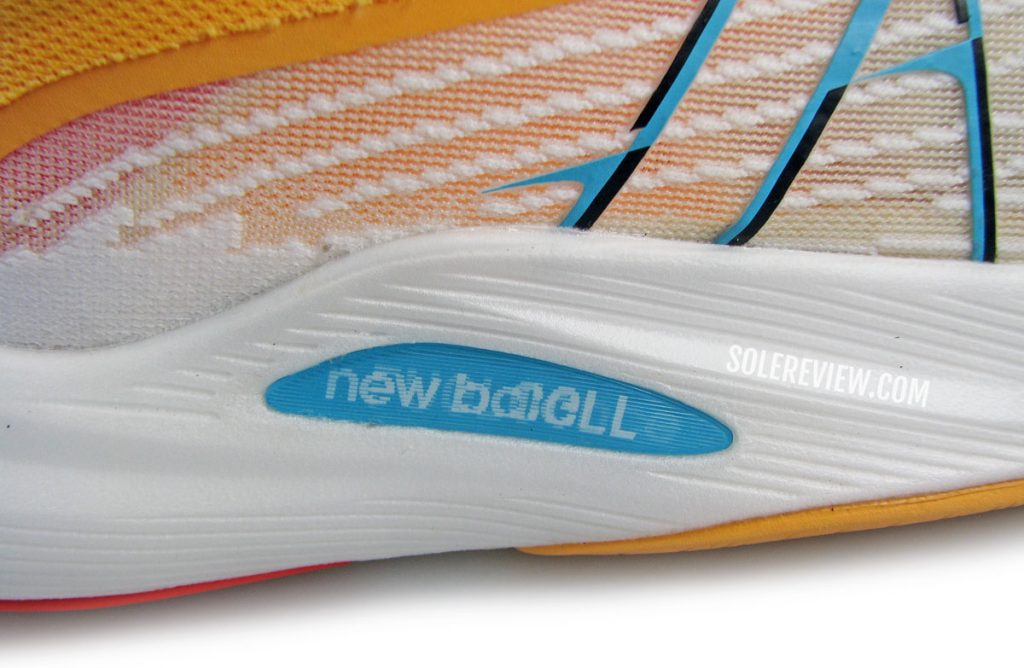 The midsole logo of the New Balance Fuelcell Rebel V2.