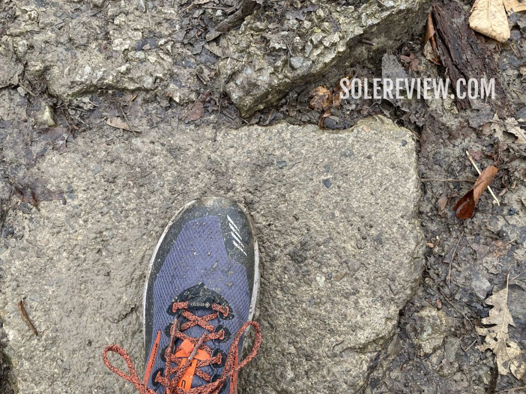 The Brooks Cascadia 16 Gore-Tex on a wet rock.