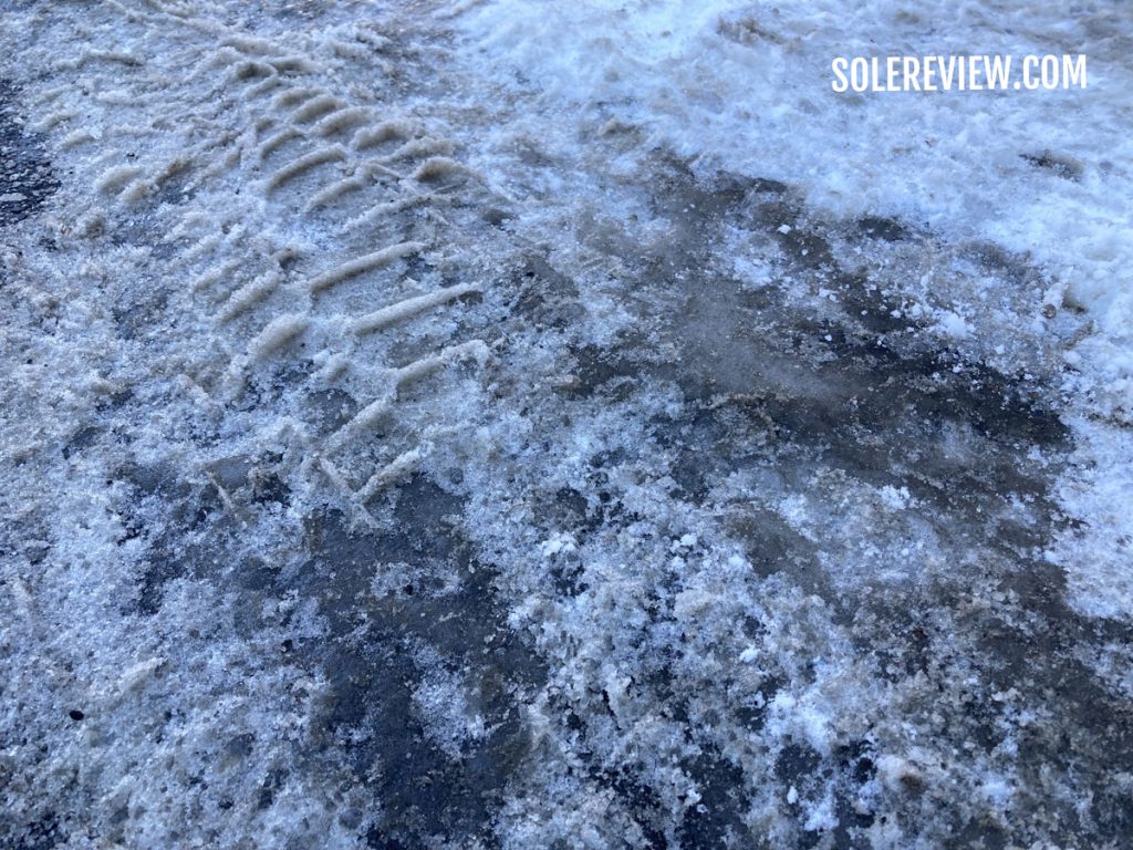 Slush and ice on winter road