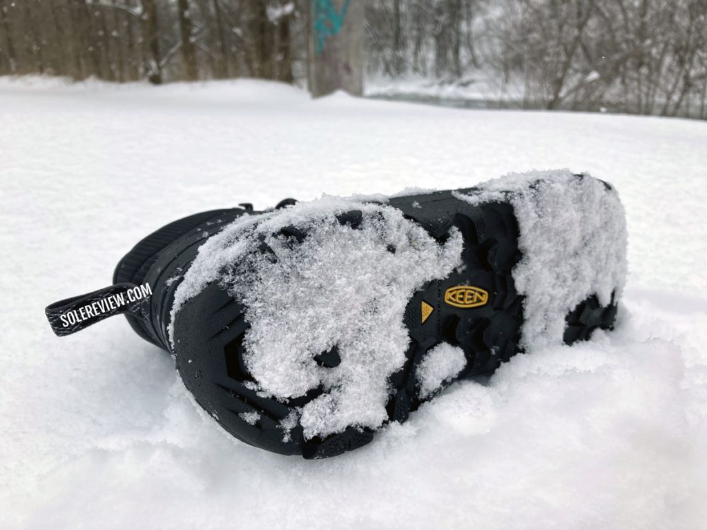 The outsole of the Keen Revel IV EXP Polar Mid boot in the snow.