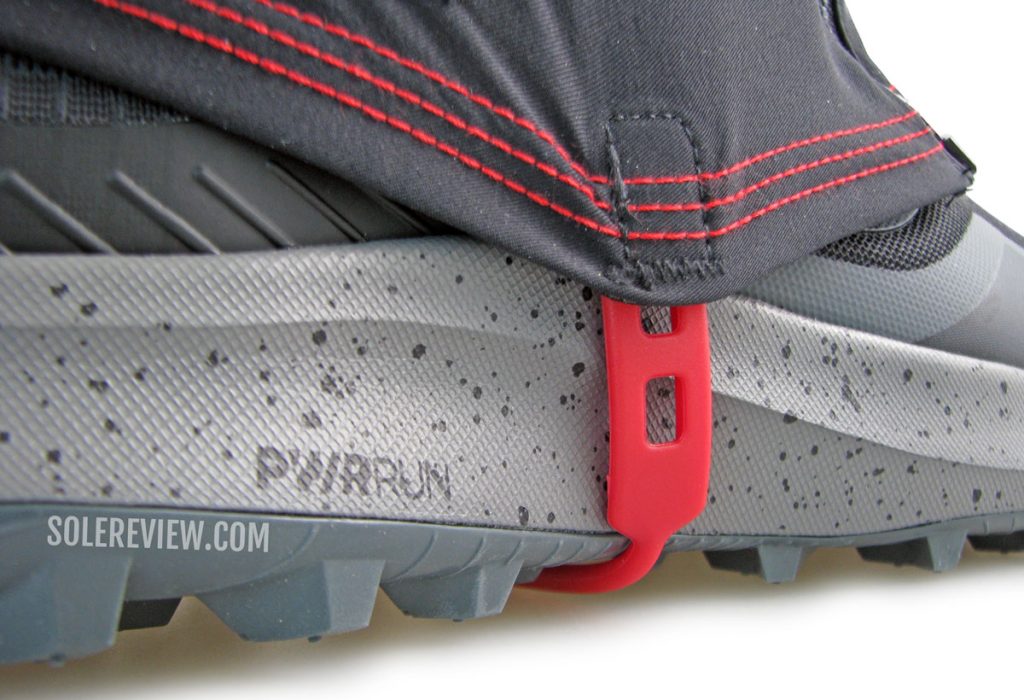 The gaiter loop wrapping the Saucony Peregrine 12.