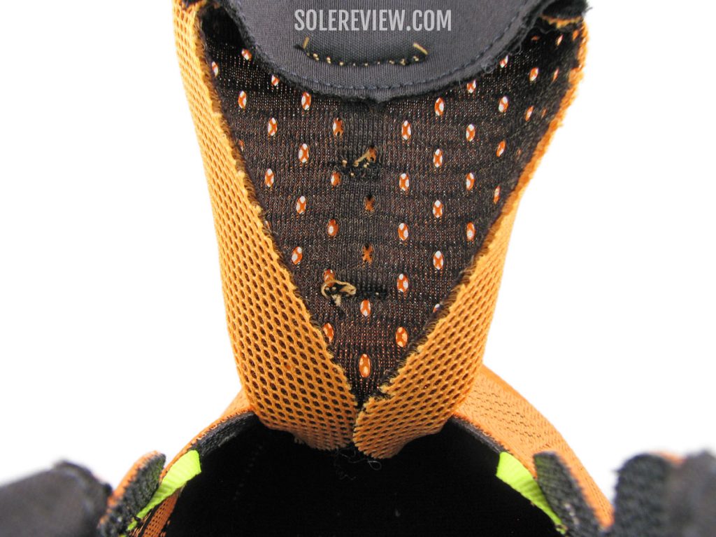 The folded tongue edges of the adidas Solarglide 5.