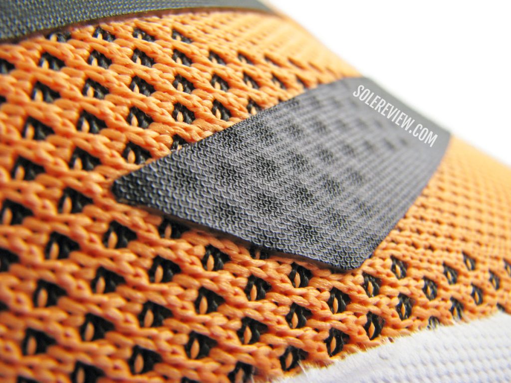 The fused logo of the adidas Solarglide 5.