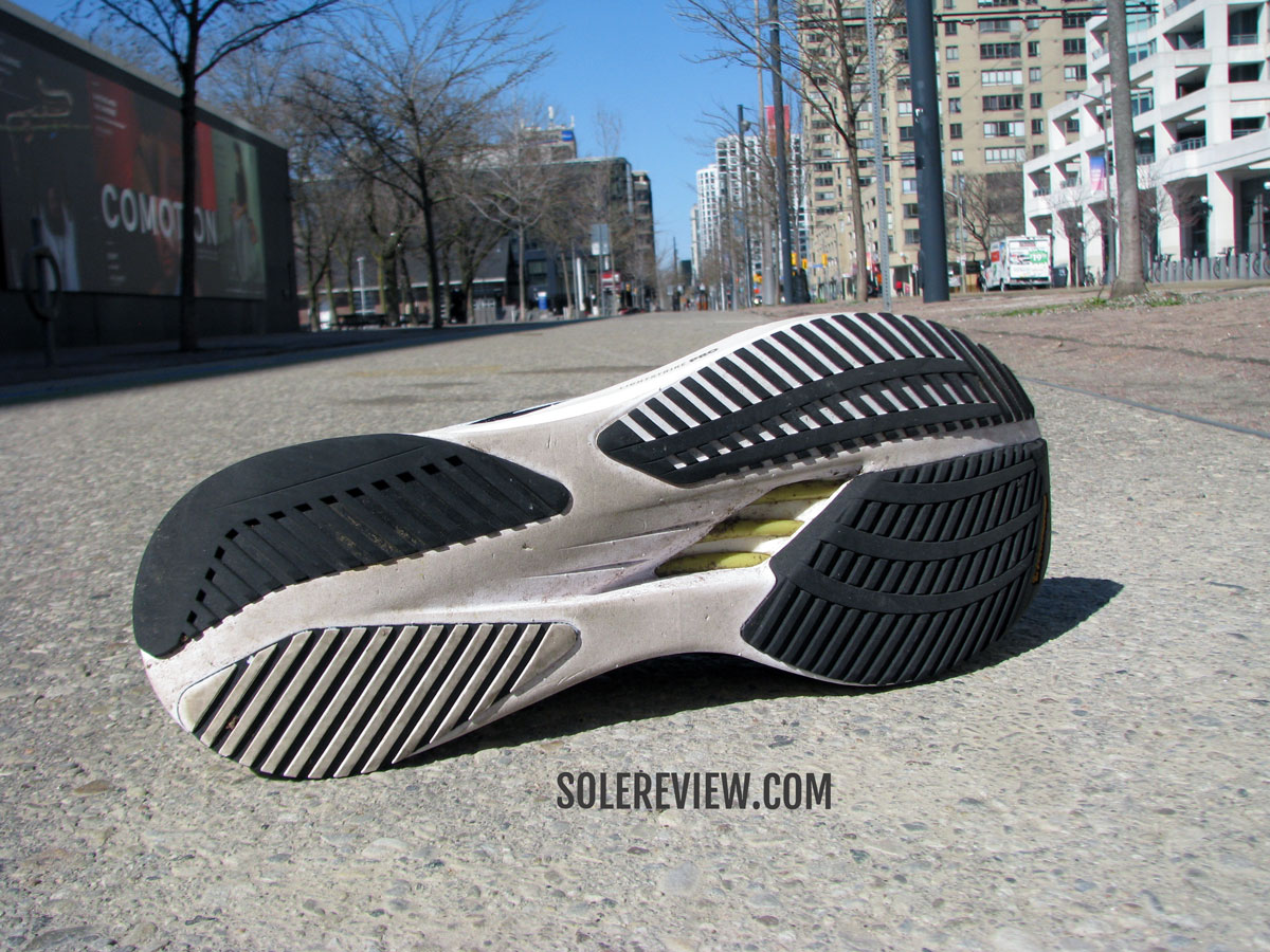 The adidas Boston 10 on the sidewalk.