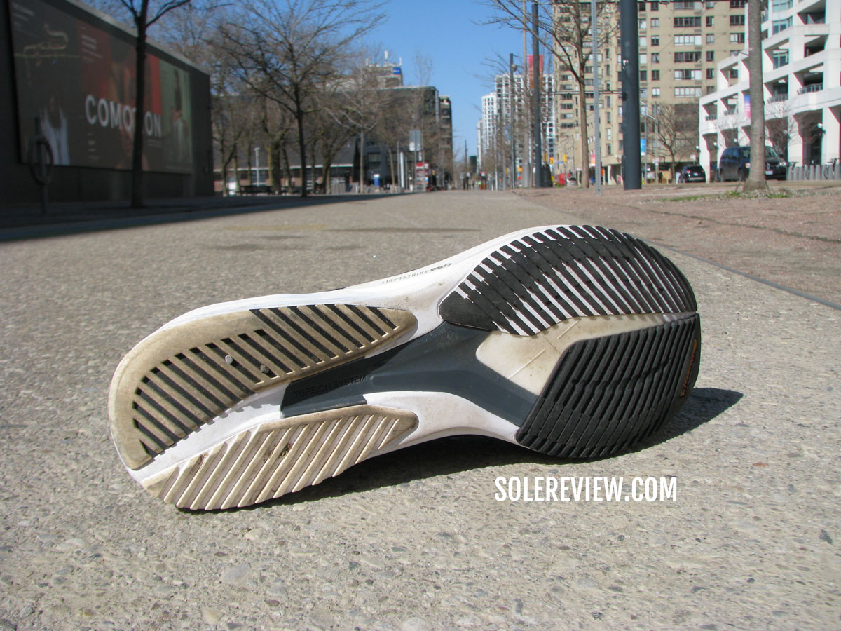 The adidas adios 6 outsole on the road.