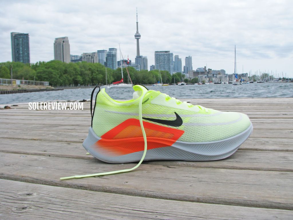 The Nike Zoom Fly 4 near the waterfront.