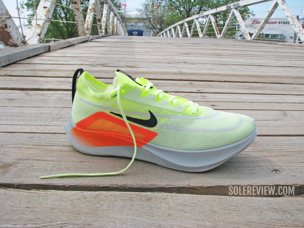 The Nike Zoom Fly 4 on a footbridge.