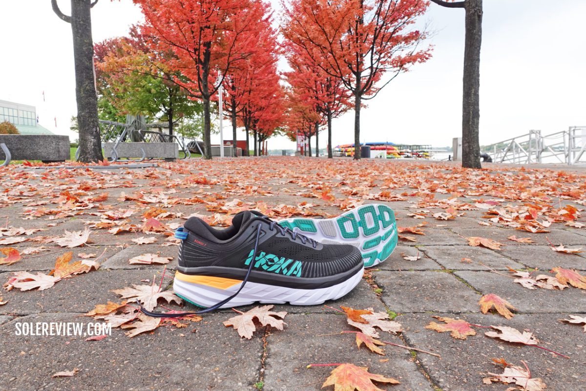 The Hoka Bondi 7 in a park.