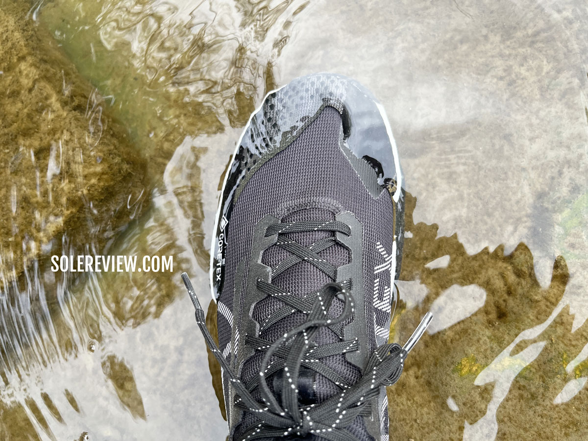 The Nike Pegasus Trail 4 Gore-Tex submerged in water.