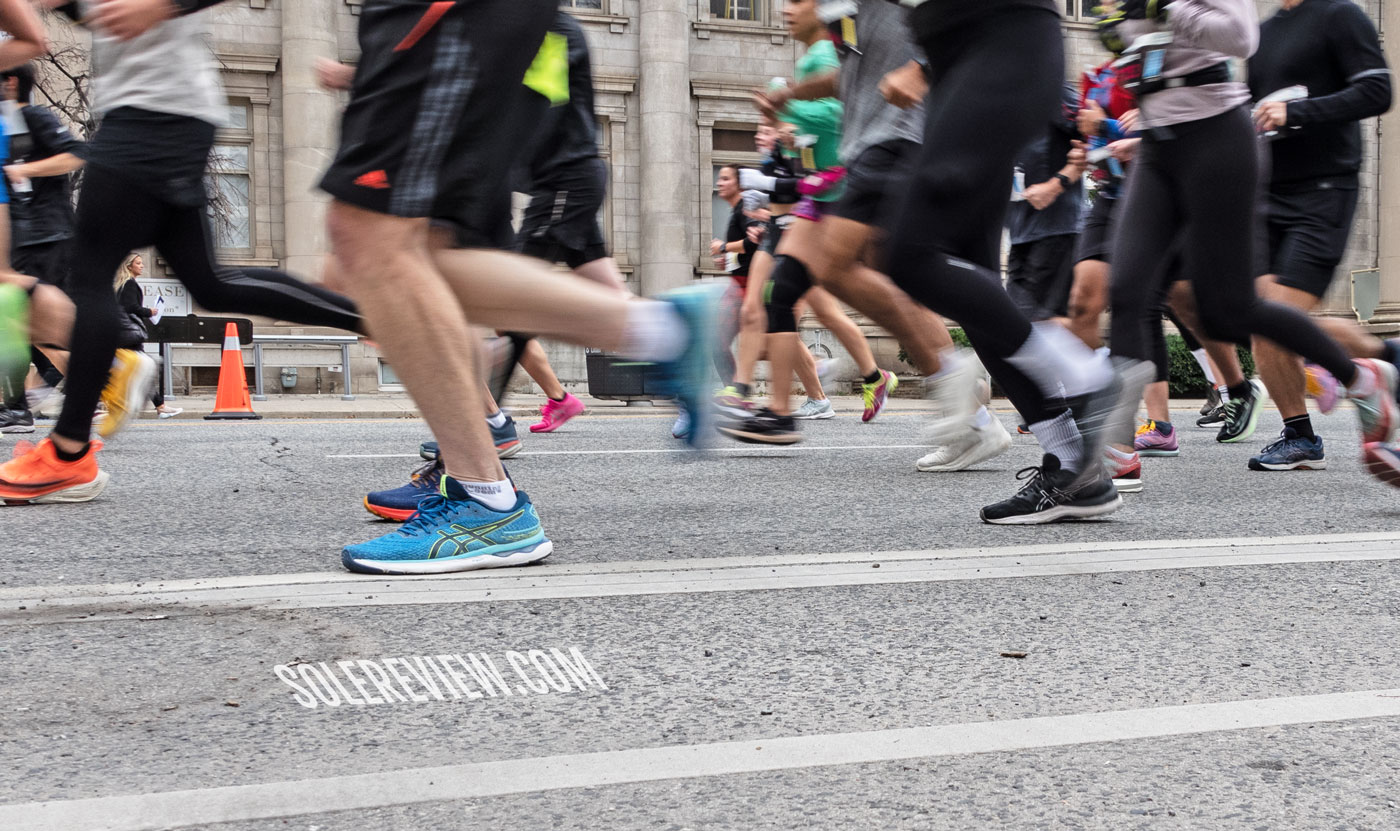 The Asics Nimbus 24 in a road race.