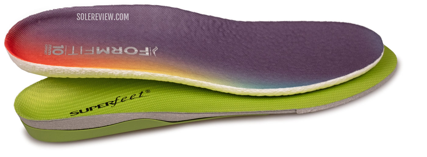 The Saucony Triumph 20 insole thickness compared with Superfeet green.