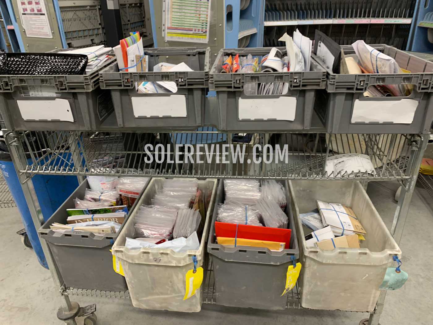 Mail sorting at postal and delivery station.