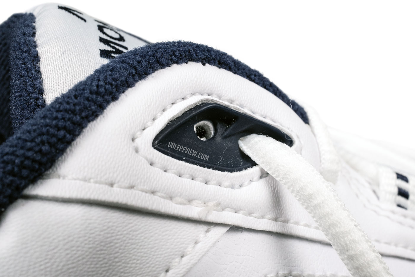 The plastic eyelet of the Nike Monarch IV.