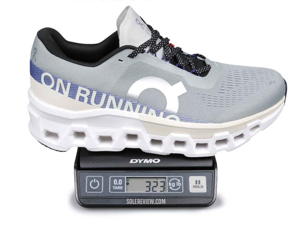 The ON Cloudmonster 2 on a weighing scale.
