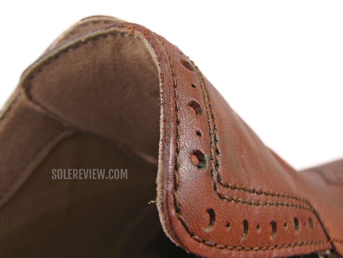 The tongue flap of the Cole Haan Originalgrand Wingtip.