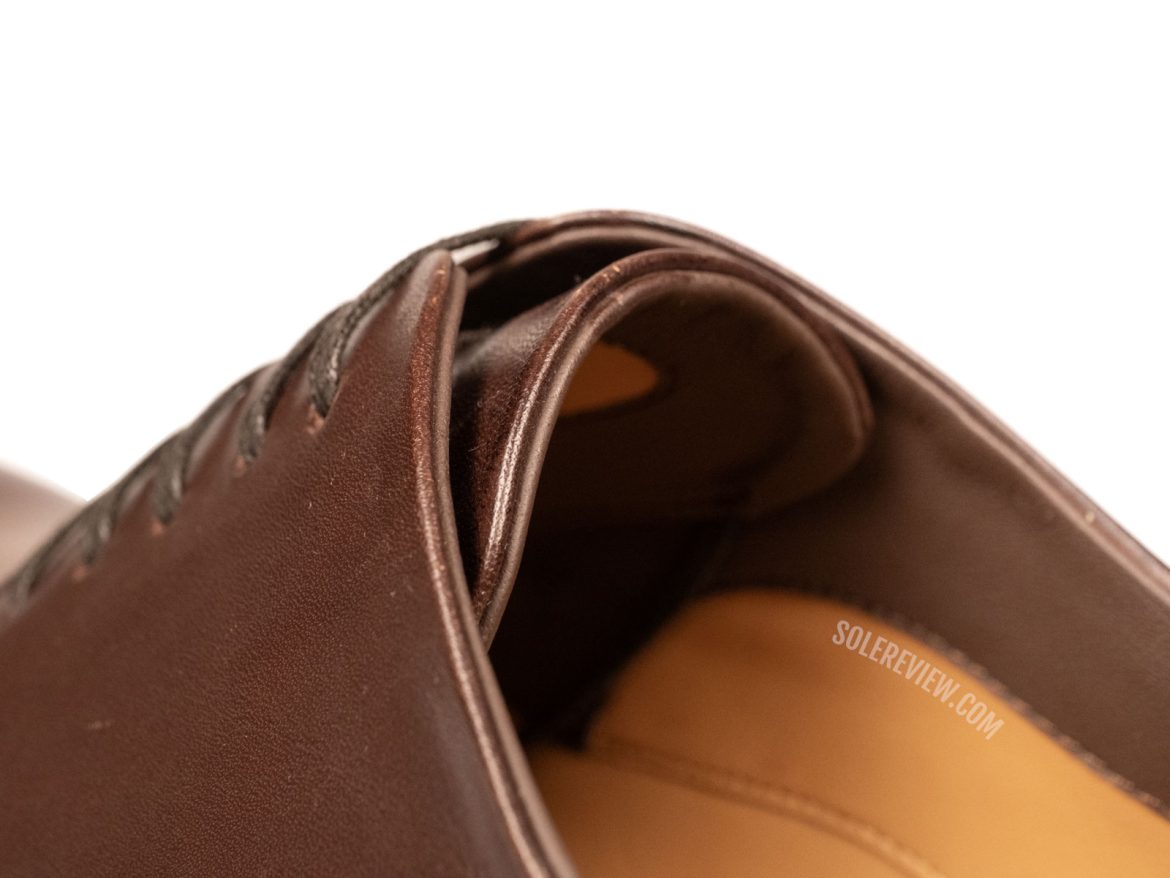 The folded tongue of the Ferragamo Tramezza Derby.
