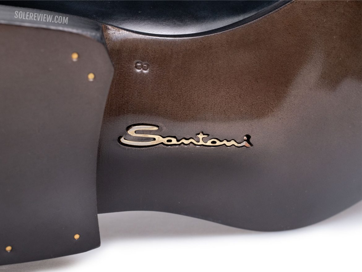 The golden logo on the Santoni Limited Edition shoe.