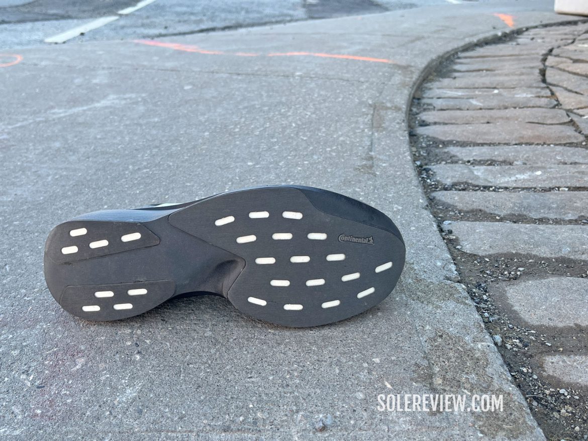 The outsole of the adidas adizero EVO SL on the road.