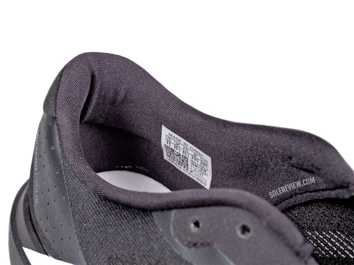 The padded heel collar of the adidas adizero EVO SL.