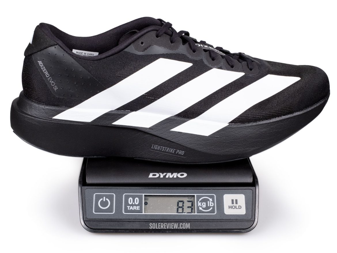 The adidas adizero EVO SL on a weighing scale.