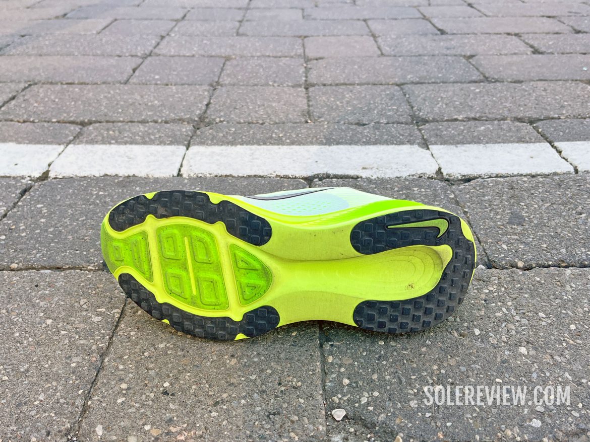 The Nike Vomero 18 on concrete.