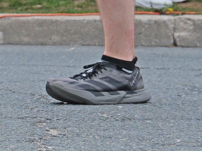 Black adidas Adios Pro 4 on the road.