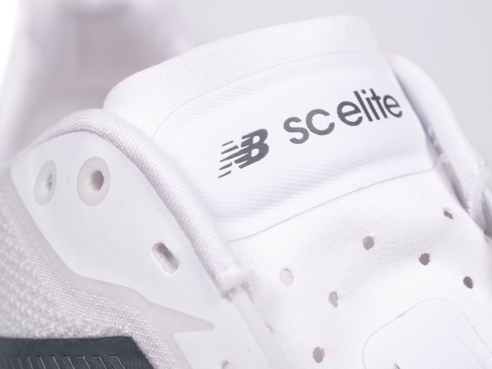 The tongue flap of the New Balance SC Elite V5.