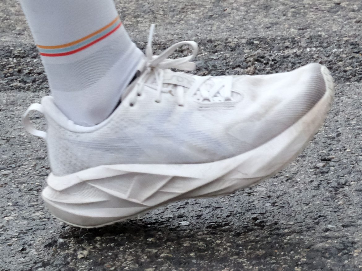 Asics_Novablast_5_white_on_road The white Asics Novablast 5 on the road.