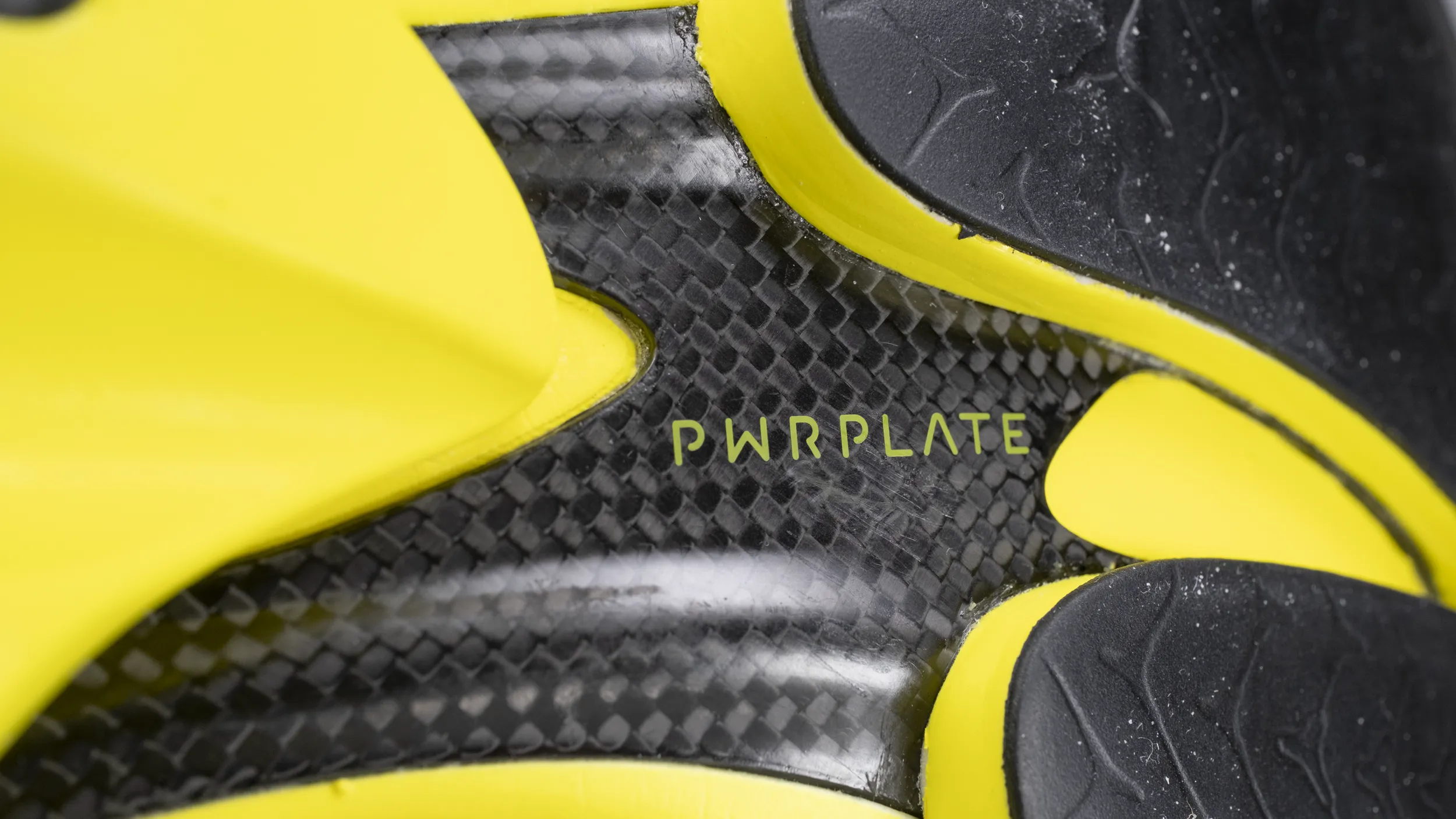 A high-resolution image of the Puma Fast R Nitro Elite 3's carbon fibre reinforced polymer plate