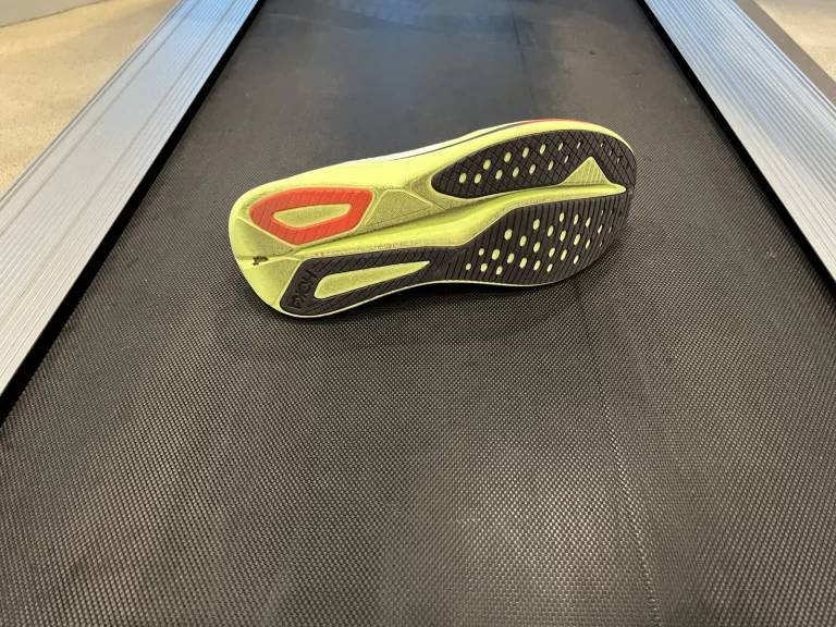 The Hoka Mach 7 on a treadmill.